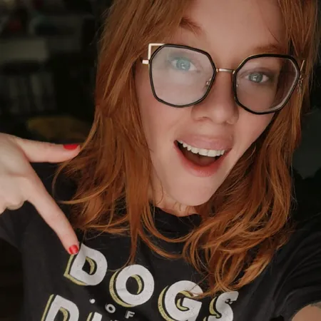 Amanda Kooi is your next pet care specialist. She is wearing a black Dogs of the Dunes shirt, matching her glasses, and is radiating with positivity. Amanda consults with dog owners to fully understand the behavioral challenges they are encountering with their dogs so she can fully address them. The expertise she brings to Dogs of the Dunes, the most affordable pet services provider in Valparaiso, IN, means Dogs of the Dunes is the best choice for pet owners looking for a local dog trainer.